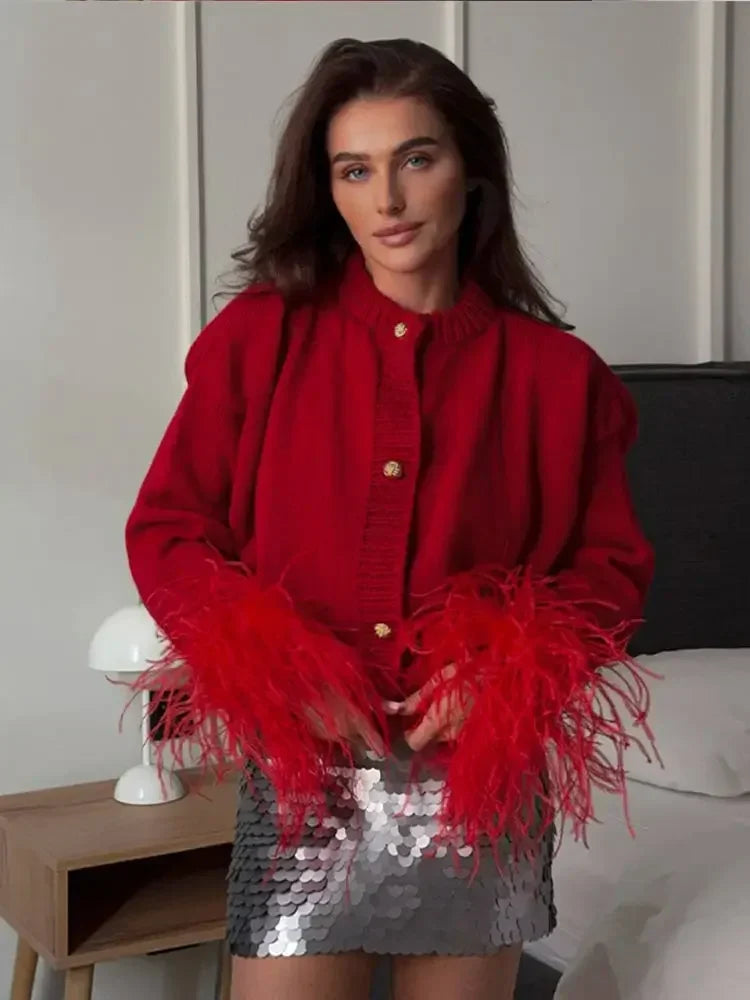 Veste en velours avec poignets en plumes