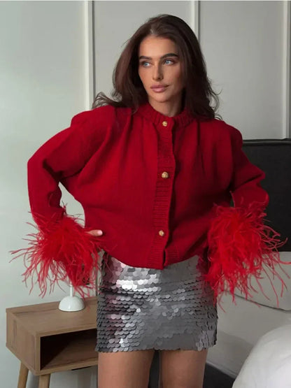 Veste en velours avec poignets en plumes